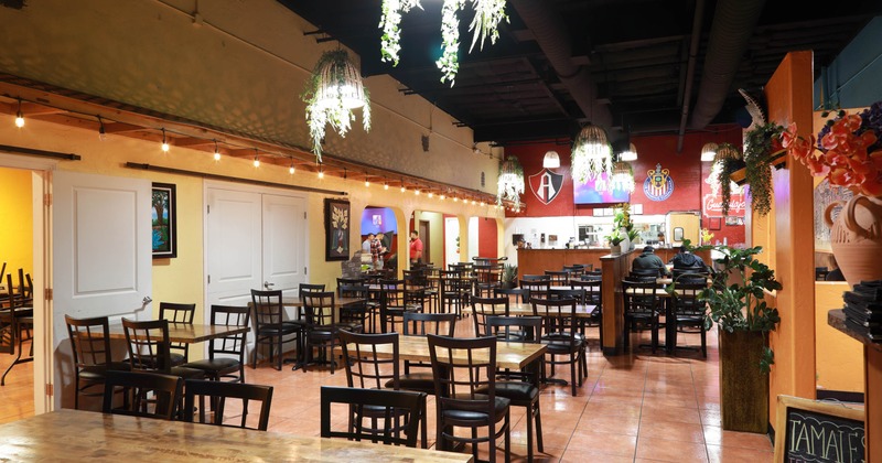 Interior, seating area with few guests in the back