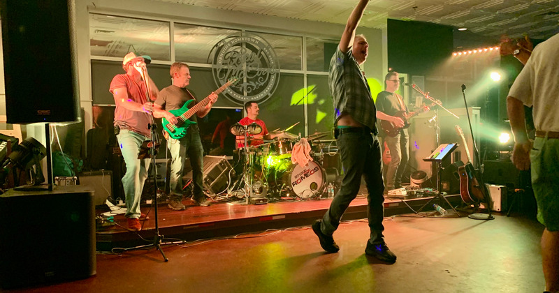 Interior, a band performing live on a stage