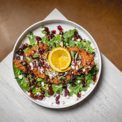 Bourbon fig chicken over greens.