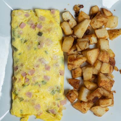Western omelet served with home fries.