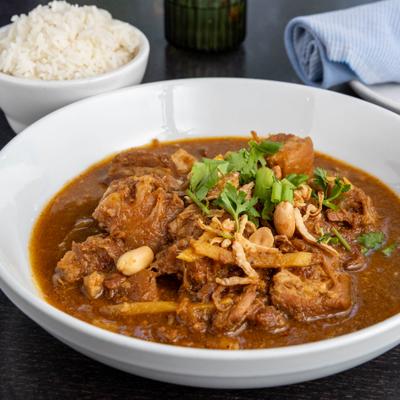 Slow cooked pork belly with ginger, fried onion, roasted peanuts and green onion.