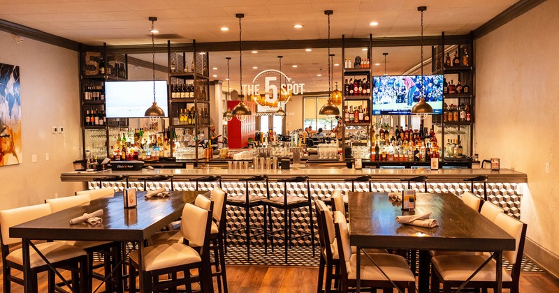 Interior, tables and chairs, bar area in the back