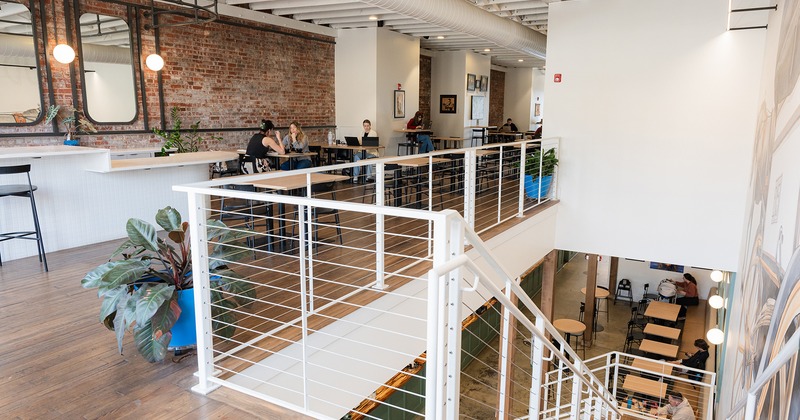 Interior, upstairs seating area and an upstairs view of the seating area below