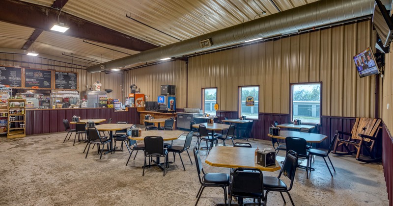 Interior, wide view of dining area, bar in the back