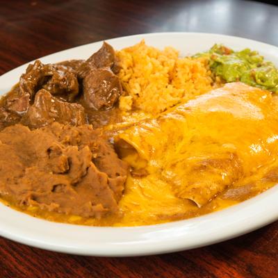 Combo plate featuring enchiladas, served alongside sides of rice, refried beans, and carne guisada.