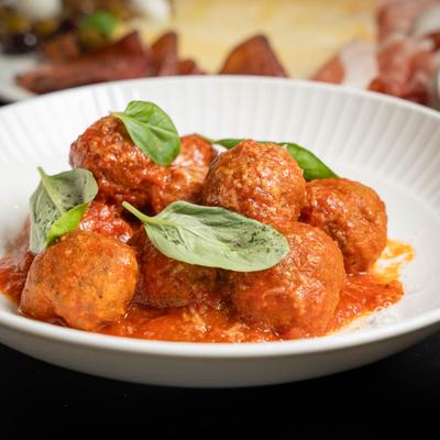 Meatballs, in tomato sauce, with basil.
