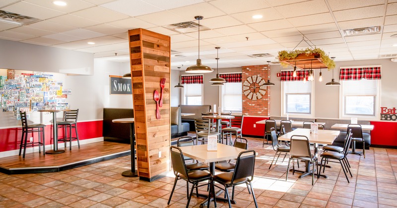 Spacious and cozy interior dining area with dining tables ready for guests