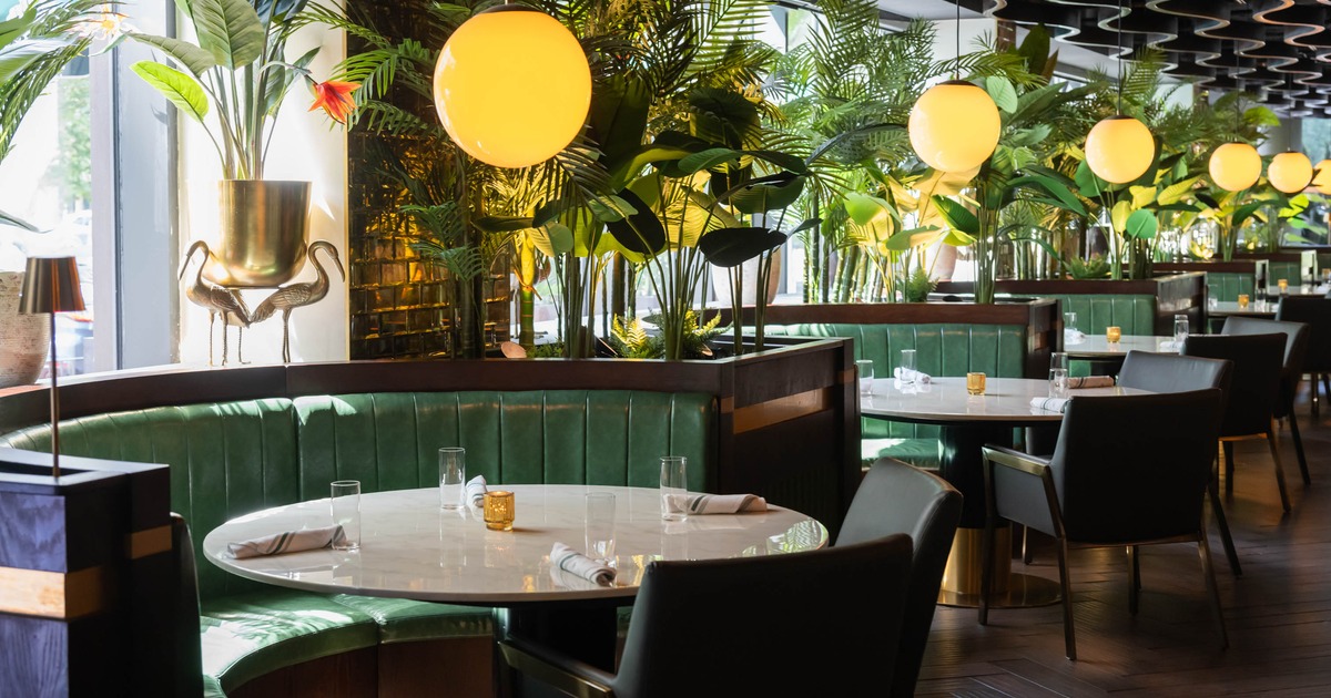 Interior, dining area, ''U'' shaped seating booths with round marble top tables