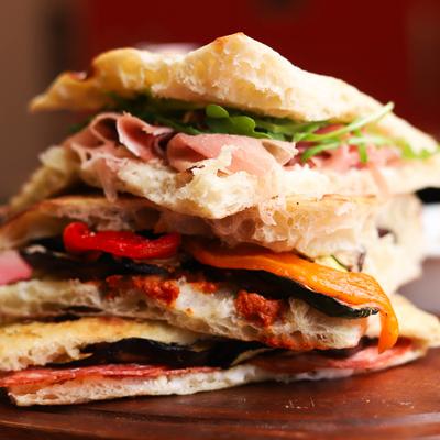 Various sandwichs stacked on top of each other.