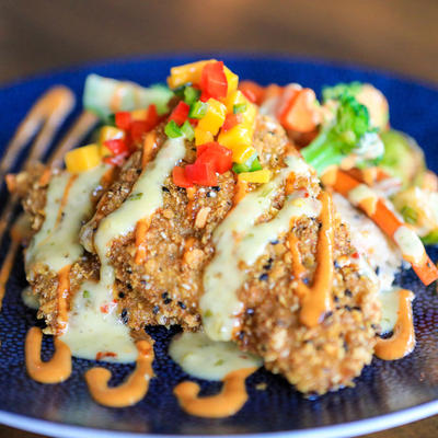 Meat with sauce and vegetables closeup