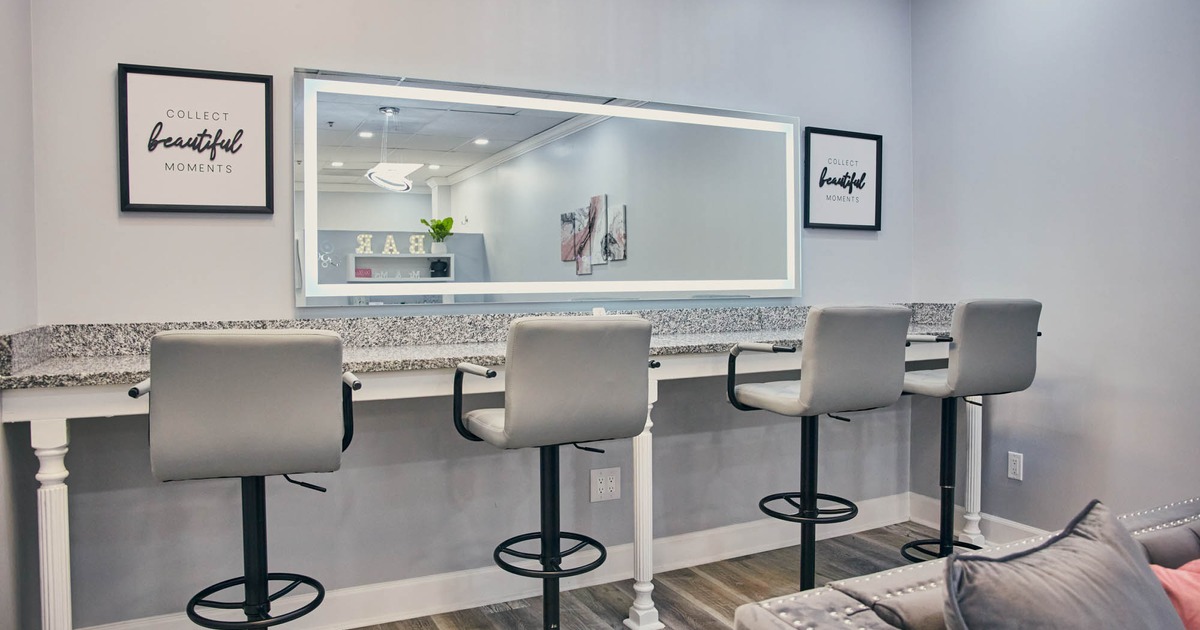 High chairs, marble table, and a wall mirror