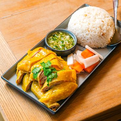 Poached chicken with veggies and rice.