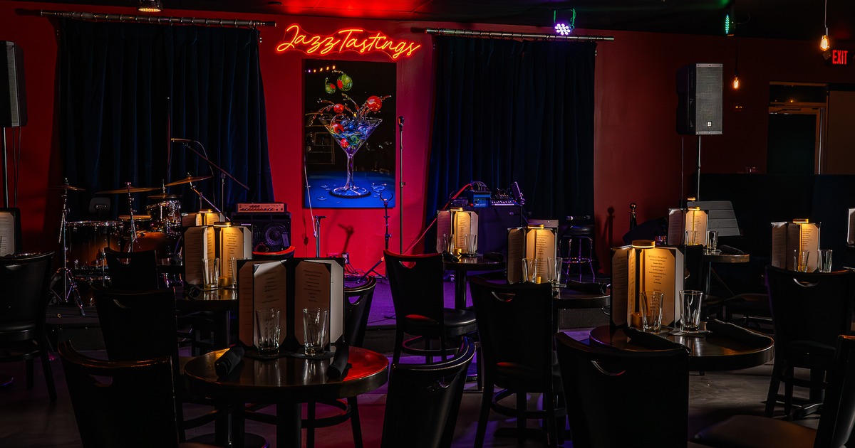 Diner area, tables, chairs, stage, decorated walls