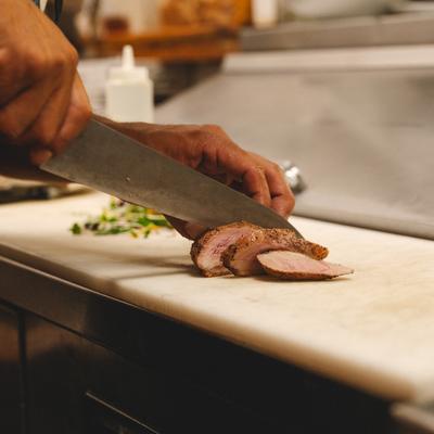 Duck breast slicing.