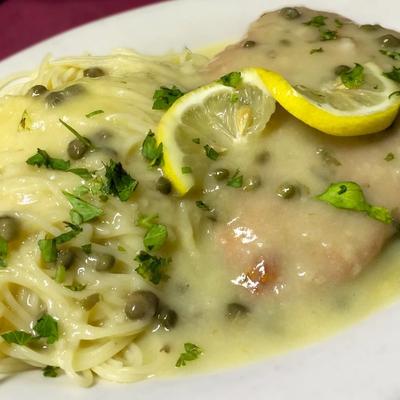 Chicken Picatta with a twist. We put bacon and mushrooms in our sauce too!.