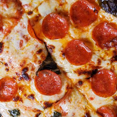 Close up of pepperoni pizza, top view.