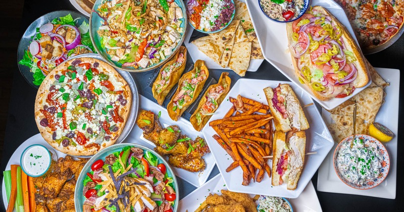 Miscellany of dishes displayed on a table, overhead view