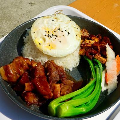 Honey glazed BBQ pork bento with white rice, fried eff, pickles , and vegetable.