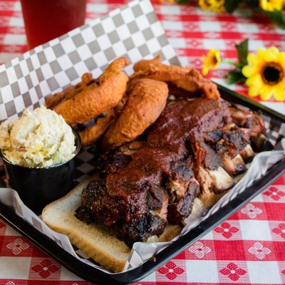 Ribs with dip and fried pastries.