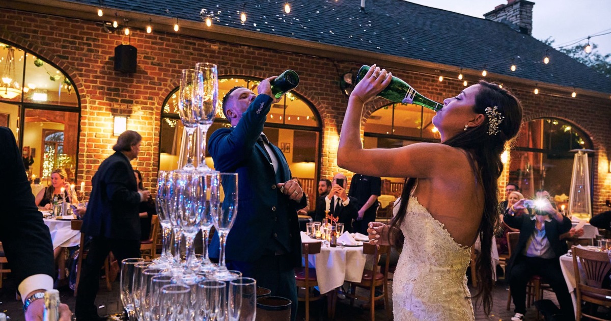 Newlyweds drinking sparkling wine