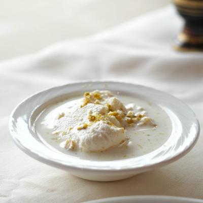 Dessert featuring soft cheese dumplings soaked in a thick, sweet milk syrup.