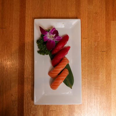 Salmon nigiri sushi plate, top view.