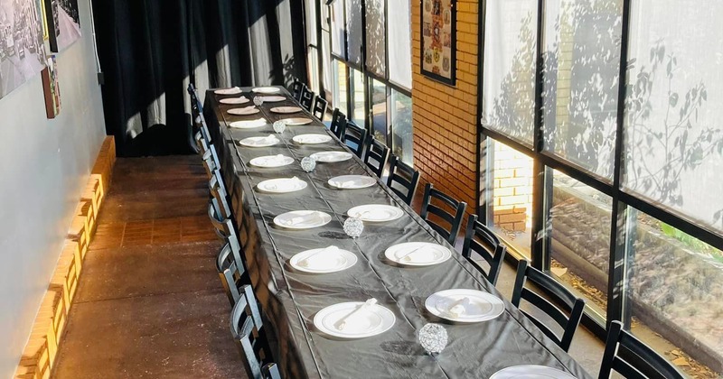 A long dining table set for a large gathering