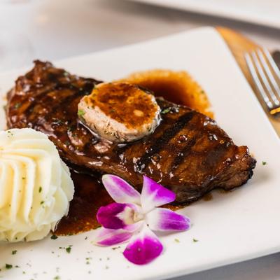 NY certified angus strip steak teriyaki served with creamy mashed potato.