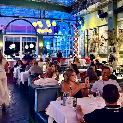 Guests having dinner at night.