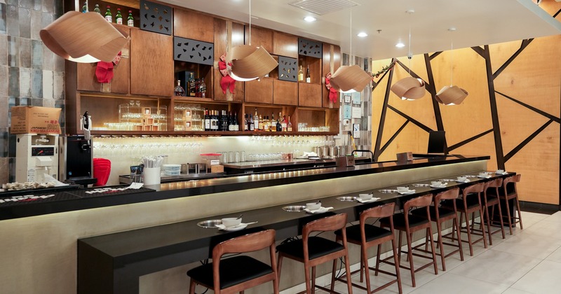 Modern interior bar area, bar counter equipped with built-in hot pot burners