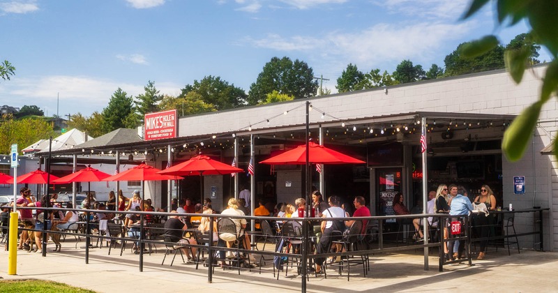 Outside, patio with guests sitting around