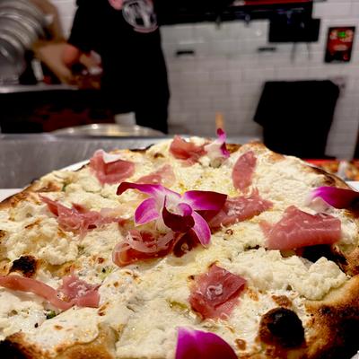 A custom pizza on the table.