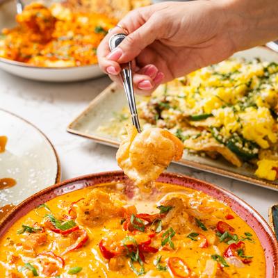 Creamy Cajun sauce, shrimp & cheesy grits.