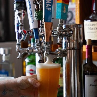 Bartender pouring beer from the tap.