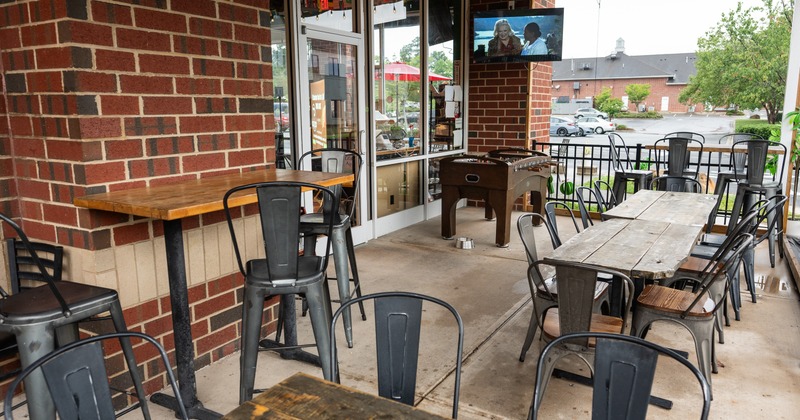Exterior, patio with tables and chairs, foosball