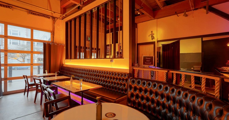 Interior, seating area, banquette bench with tables and chairs, room dividers