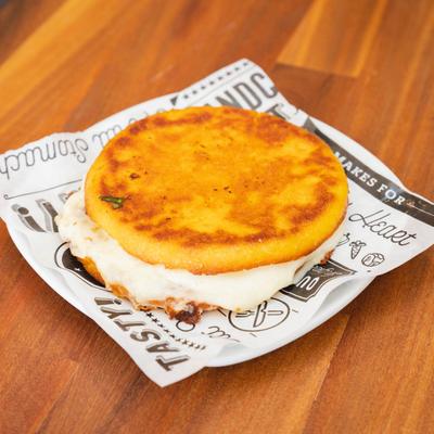 Cornmeal dough sandwich with cheese.