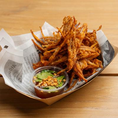 Fried taro, served with a cup of sweet peanut dipping sauce.
