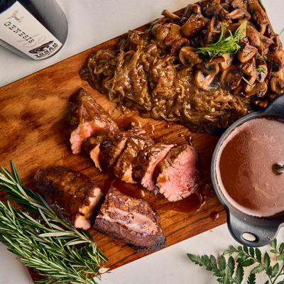 Beef medallions served with sautéed onions and red wine demi glace.