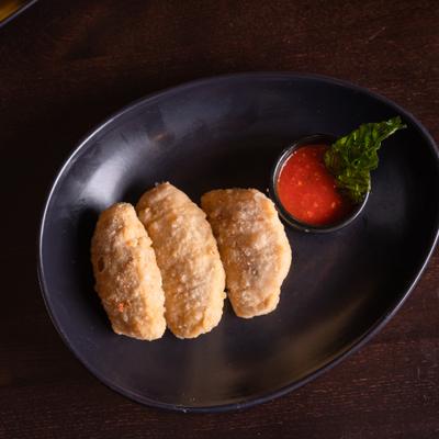 Fried pizza dough, with marinara sauce.