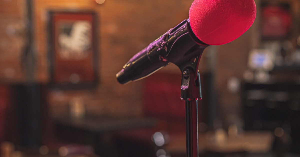 Interior, closeup of a microphone on the stage