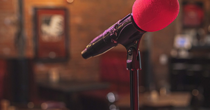 Interior, closeup of a microphone on the stage