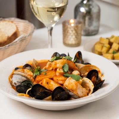 Fresh calamari, mussels, clams, jumbo shrimp, and fish filet soup.