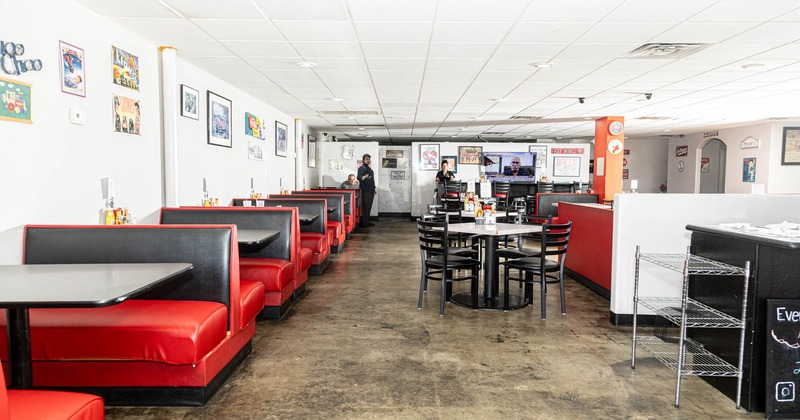 Interior, booths on the left tables with chairs on the right