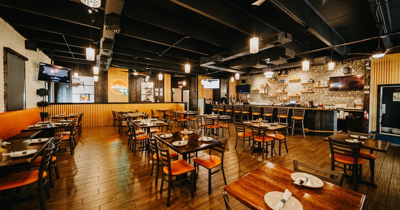 Interior space, dining area with set tables and bar