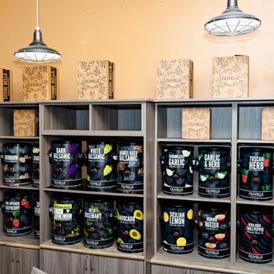 A display of Olivelle gourmet olive oils and balsamic vinegars.