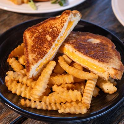 Grilled cheese sandwiches and fries.