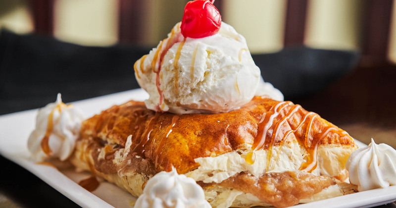 Dessert with meat and fruit on top