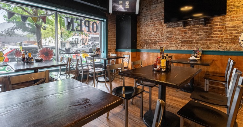 Interior, tables and chairs near window