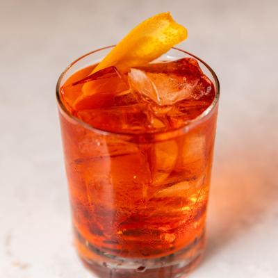 Negroni Sbagliato cocktail with orange peel garnish.